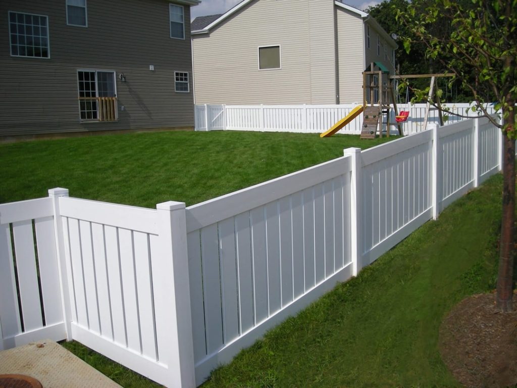 white vinyl fencing in a yard