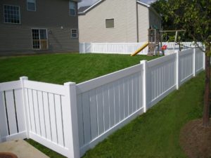 Fence Installation Des Peres MO white vinyl fencing in a yard