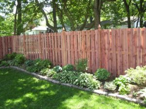 Fence Installation Warson Woods MO Gorgeous landscaping along wood fence